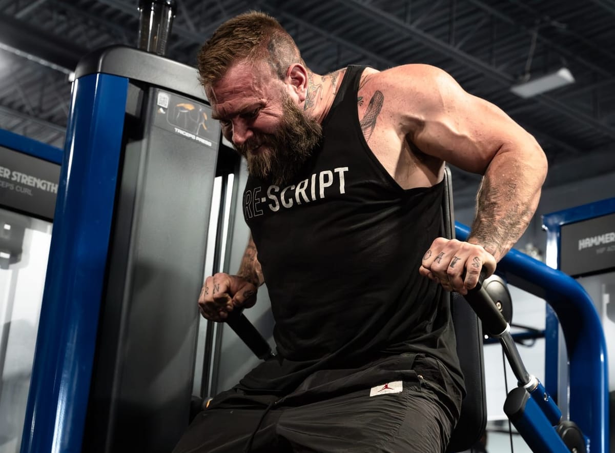 Jordan Shallow using a pin-loaded dip machine.